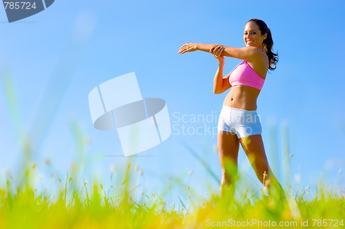 Image of Athletic Woman Exercising 