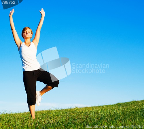 Image of Young Woman Doing Yoga