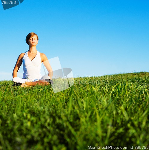 Image of Young Woman Doing Yoga