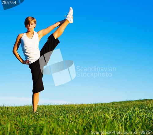 Image of Young Woman Doing Yoga