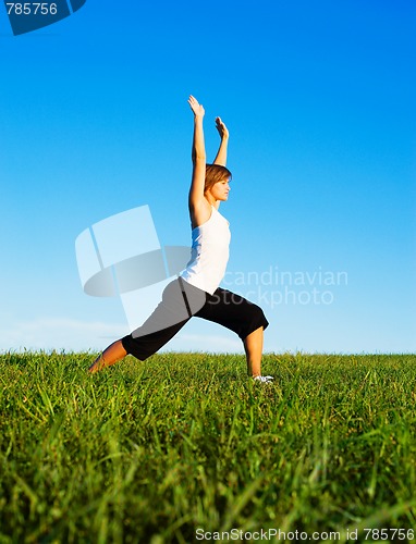 Image of Young Woman Doing Yoga