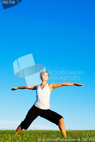 Image of Young Woman Doing Yoga
