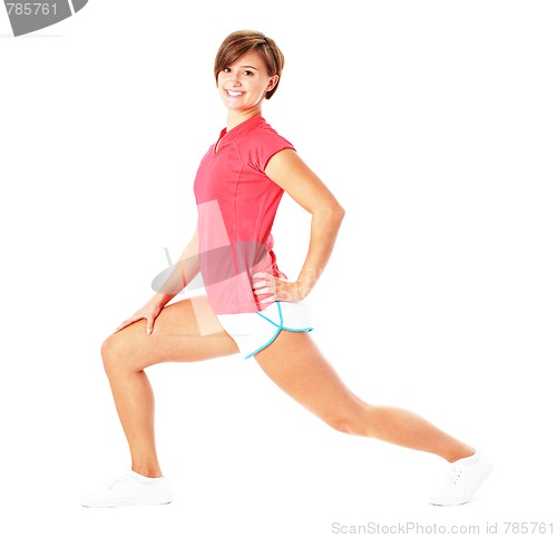 Image of Young Fitness Woman in Red Shirt Stretching, Isolated on White