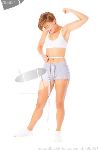 Image of Young Woman Measuring Herself