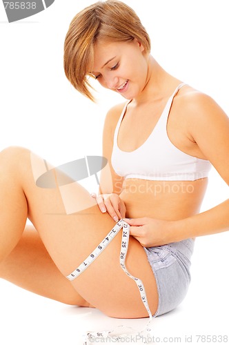 Image of Young Woman Measuring Herself