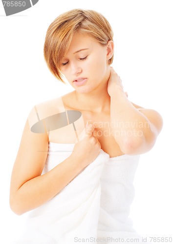 Image of Woman in Towel Massaing Herself