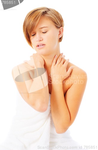 Image of Woman in Towel Massaing Herself