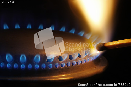 Image of Match lightening a gas stove