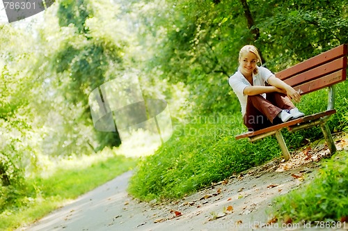 Image of Girl on Forest Bench