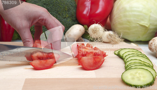 Image of Hand cutting vegetables
