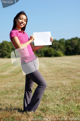 Image of Girl with blank sign in field