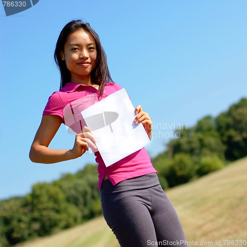 Image of Girl with blank sign in field