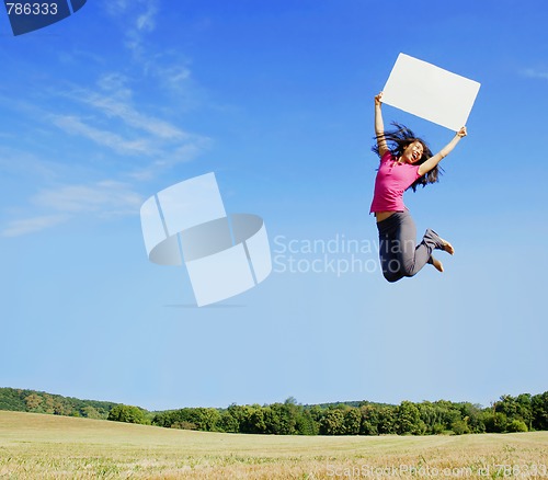 Image of Girl Jumping With Sign