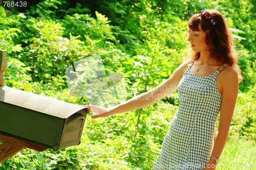 Image of Girl Checking Mail