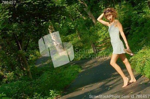 Image of Pretty girl on forest path