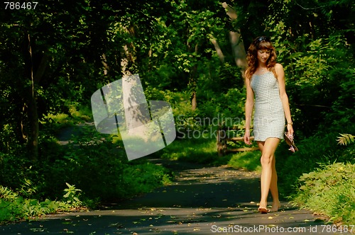 Image of Pretty girl on forest path