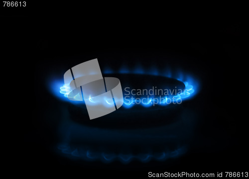 Image of Gas burner with flames on dark background