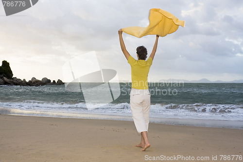 Image of Happy woman on a beach