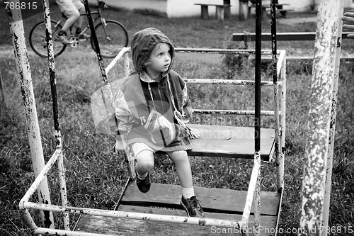 Image of Little girl on swing