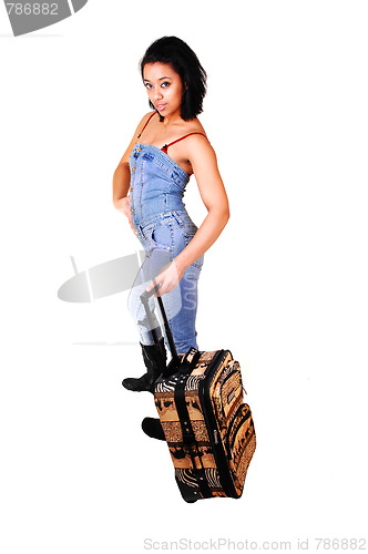 Image of Girl in jeans suit on a trip.