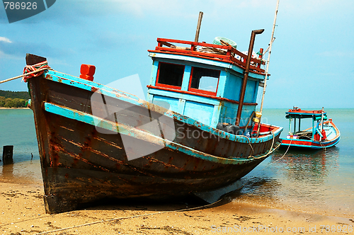 Image of Fishermans boats on the ocean coast.