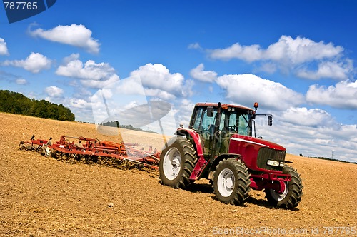 Image of Tractor in plowed field