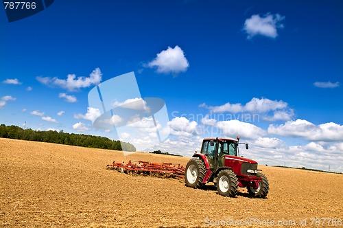 Image of Tractor in plowed field