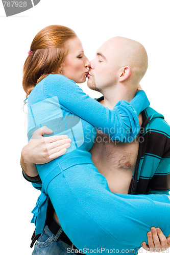 Image of Man kiss and carry woman