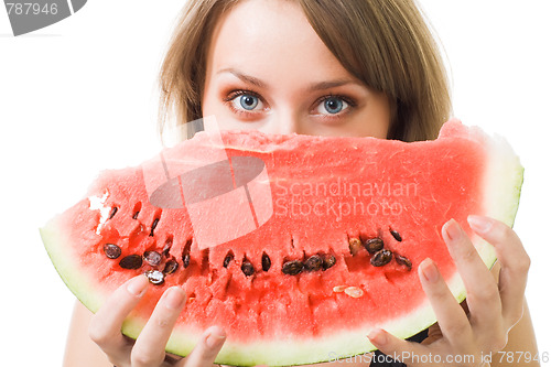 Image of woman stare behind watermelon