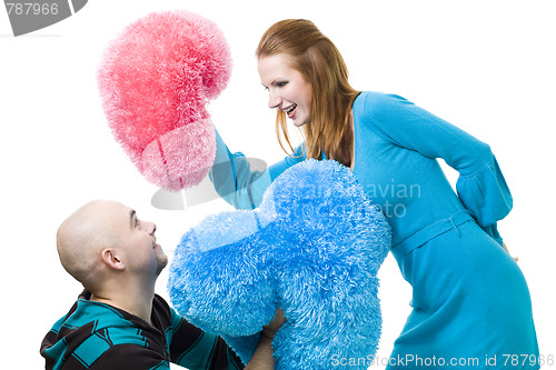 Image of Couple fighting with cushions