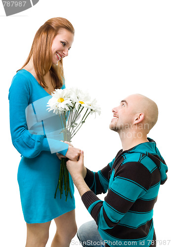 Image of Man giving camomile to woman