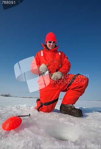 Image of Smiling ice fisherman