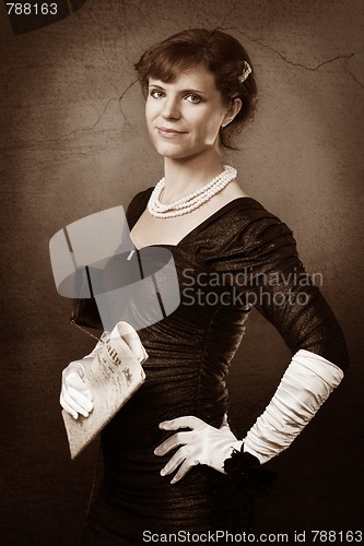 Image of Old style portrait of woman with newspaper