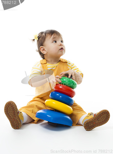 Image of Baby girl play with pyramid