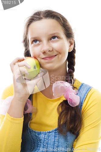 Image of young teenager girl with apple standing