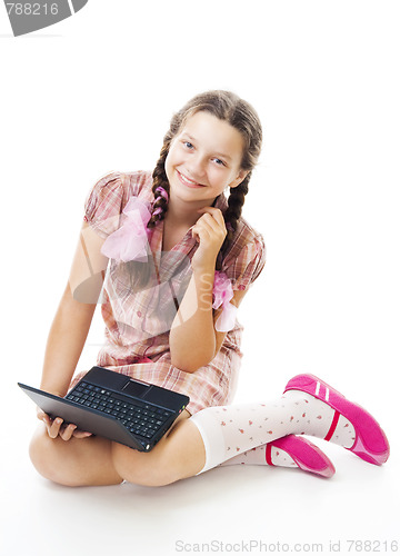 Image of Teenager girl sit holding small laptop