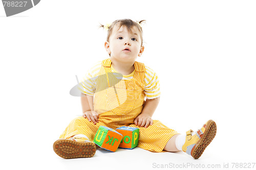 Image of Young kid play with block with letters