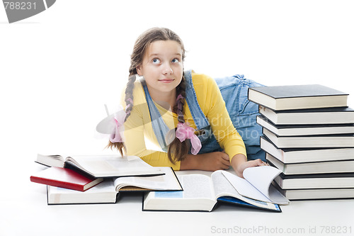 Image of Clever teenager girl with books