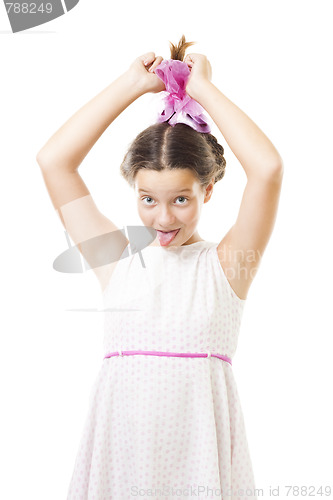 Image of Girl in pink play the fool stick her tongue