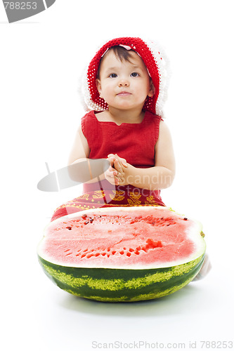Image of Baby sit with watermelon