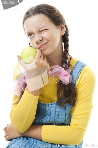 Image of dissatisfied teenager girl with apple 