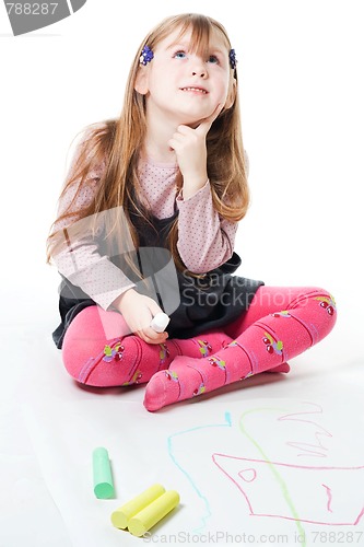 Image of LIttle girl thinking and drawing