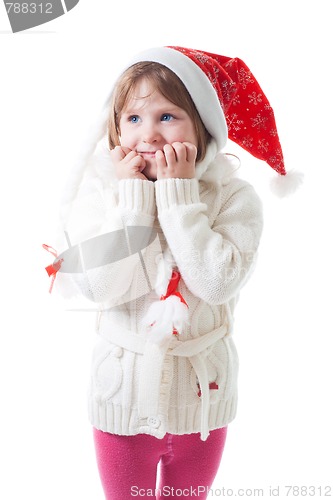 Image of Little girl in santa cap wait for christmas