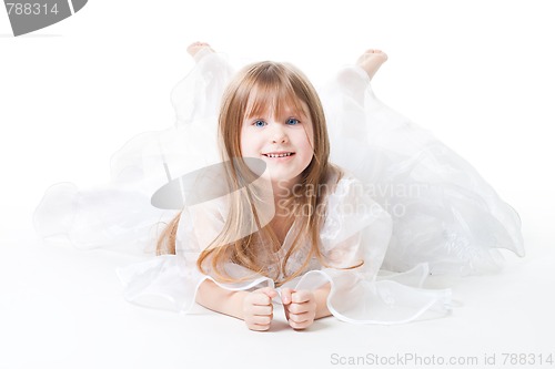 Image of Little girl wear dress lay on the floor