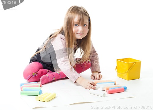 Image of Little girl draw with chalks