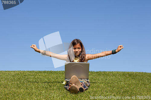 Image of gilr using wireless internet at the park