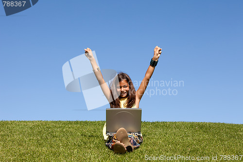 Image of gilr using wireless internet at the park