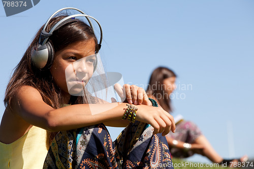 Image of young child listening music