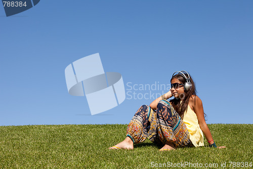 Image of young child listening music