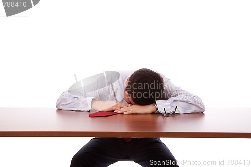 Image of Businessman sleeping at the office